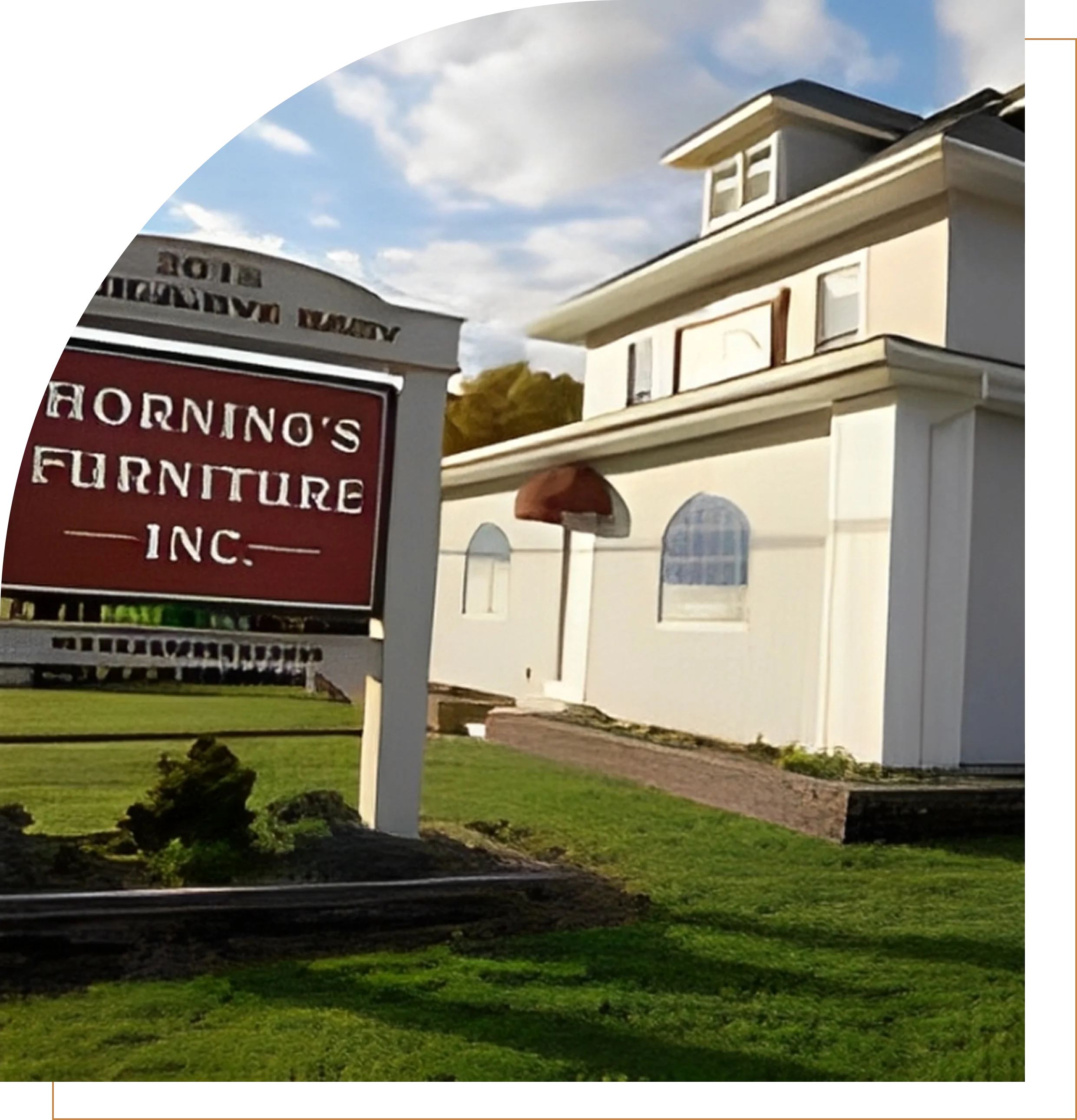 Group 1321317591 A white building with a sign for Horning's Furniture Inc.