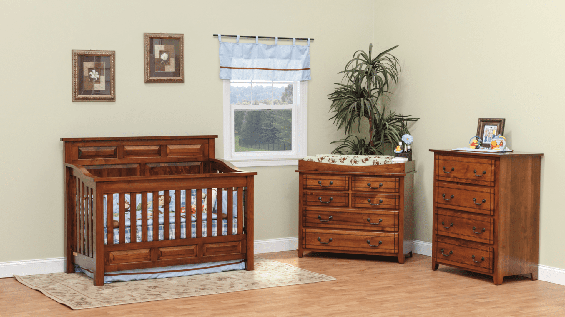 A cozy nursery with wooden crib and dresser under a window.