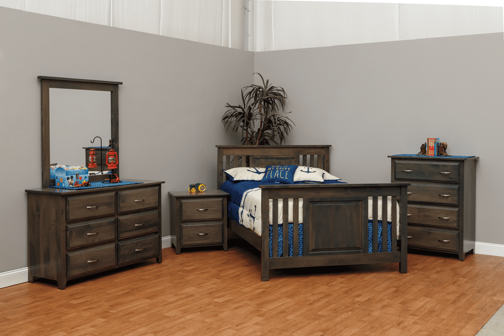 A bedroom with dark wood furniture and a neatly made bed.